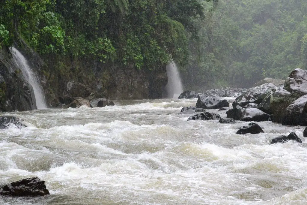 Top adventurous things to do in Costa Rica - Penas Blacas level III and IV rapids with rocks and waterfalls 
